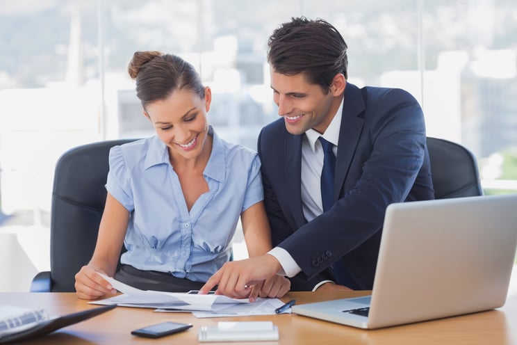 Smiling business people working together in the office